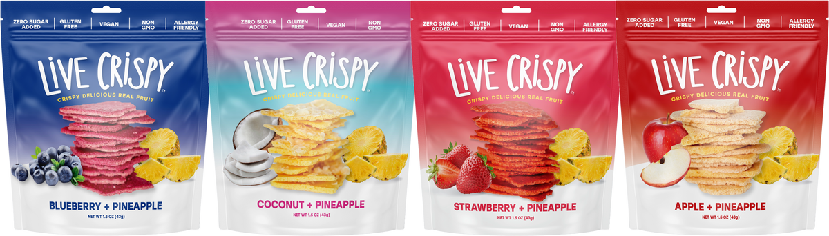 The four Live Crispy bags: blueberry, coconut, strawberry and apple, each with pineapple