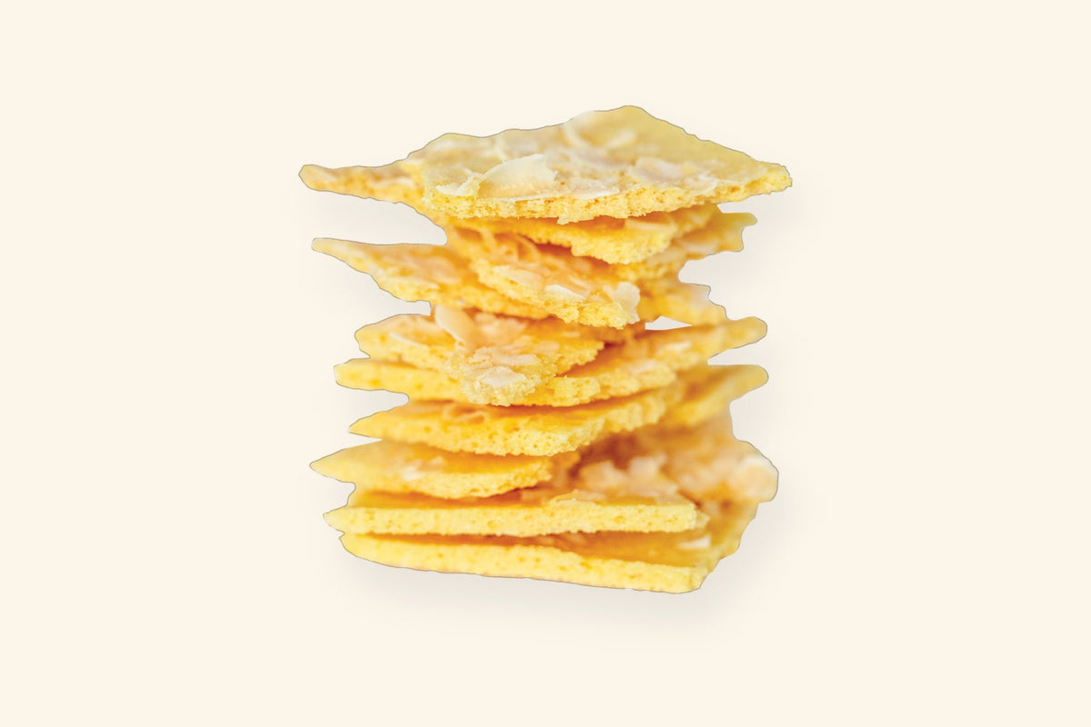 A stack of baked coconut and pineapple chips