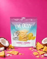 Live Crispy Coconut + Pineapple bag with coconut chips and fresh coconut on pink