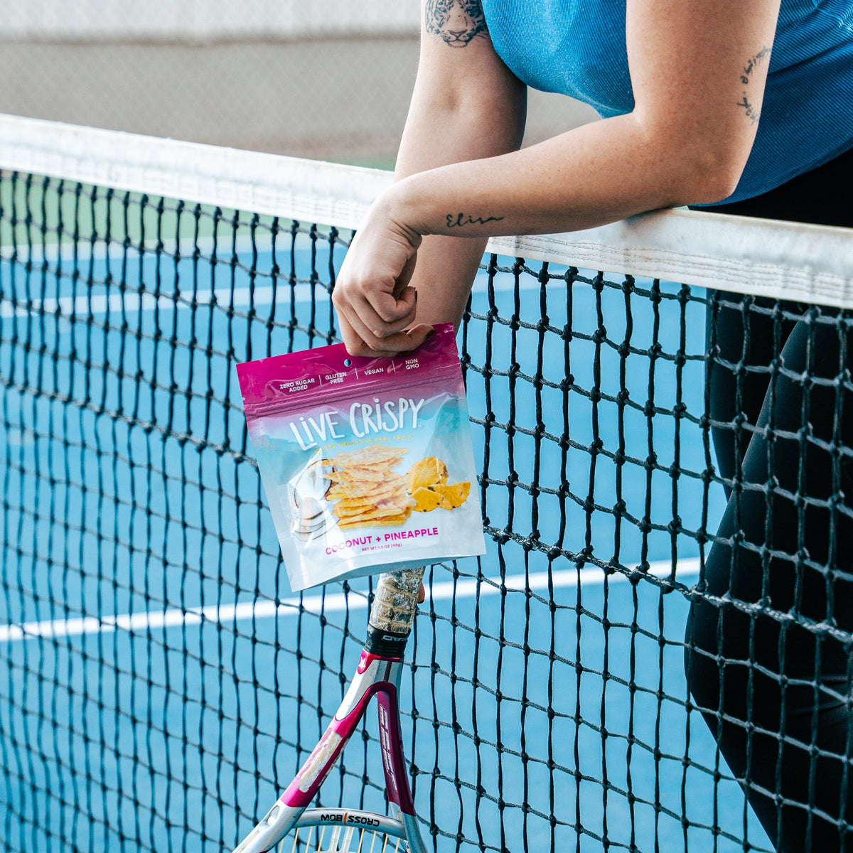 Coconut and Pineapple bag held at a tennis net